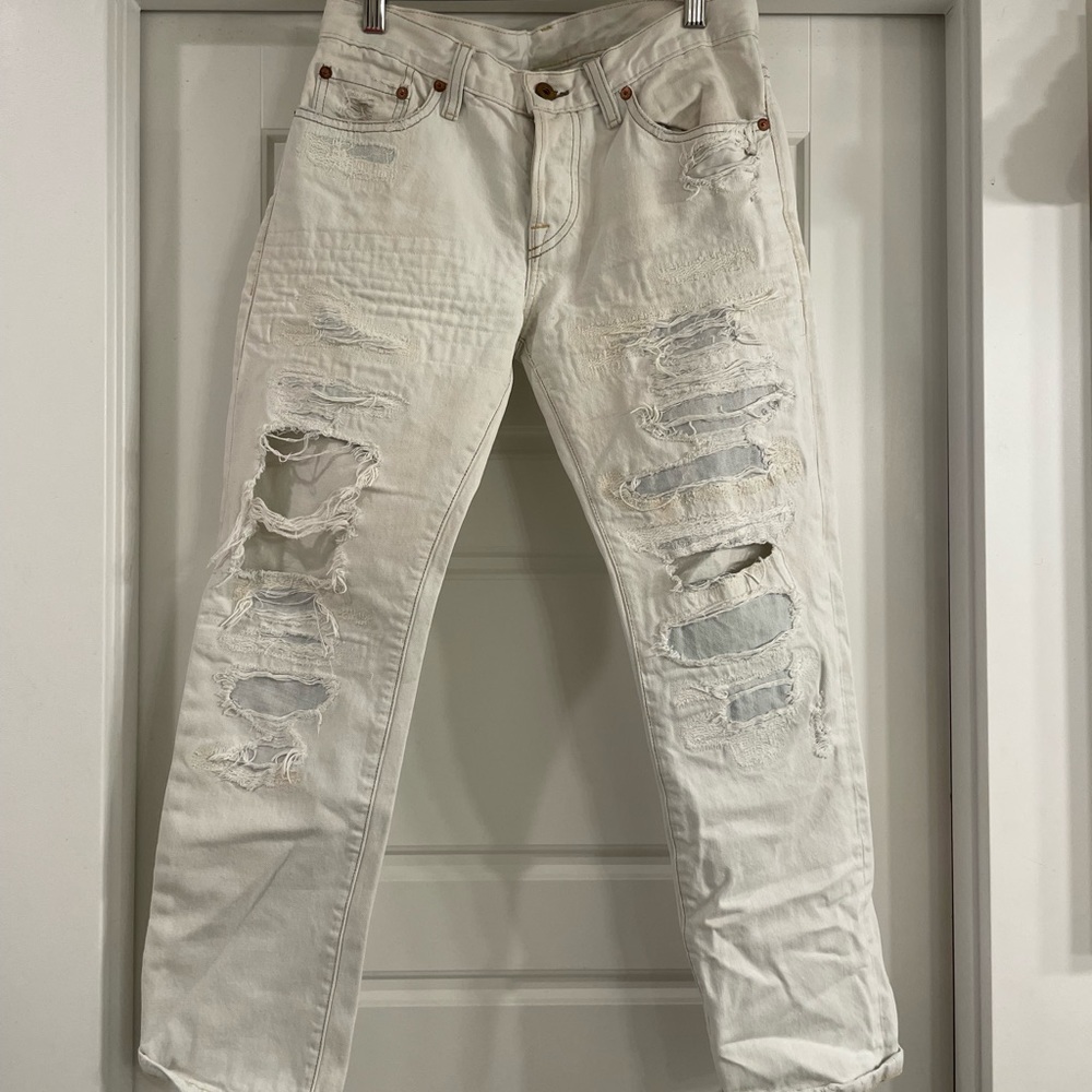 NSF, cream ripped jeans.